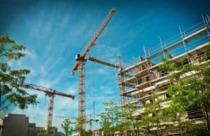a building site with 3 cranes