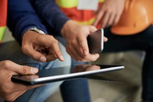 2 Person working on Construction Plans on a Tablet