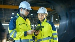2 person looking at a tablet