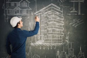 Contractor drawing on a board.