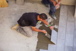 Tile flooring contractors are working.