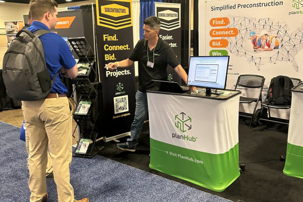 employee giving information at the fair