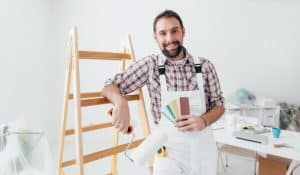 A Painter smiling at the camera