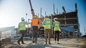 4 men in front of a construction site