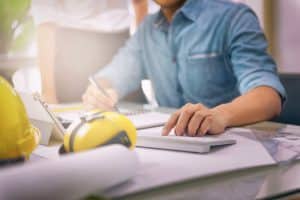 a man working on Construction Plans