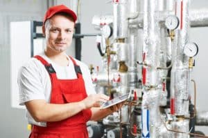 A HVAC Worker with a Tablet